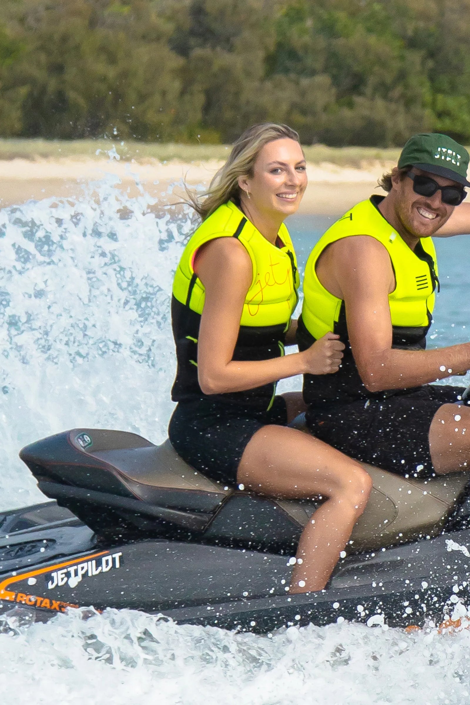 Riders wearing Jetpilot Eden life jackets on a jet ski