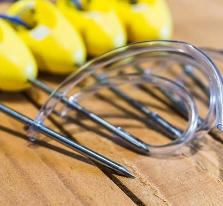 Ikipik fish spikes showing the curved stainless steel spike and yellow handle